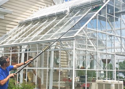 man cleaning sunroom